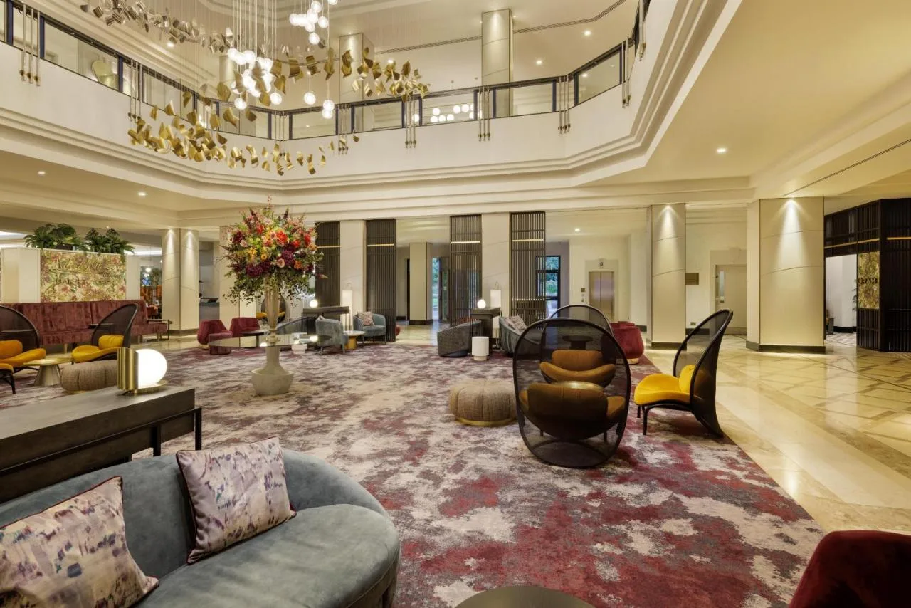 Large lobby with chandelier and seating at Hilton Glasgow, Glasgow city centre