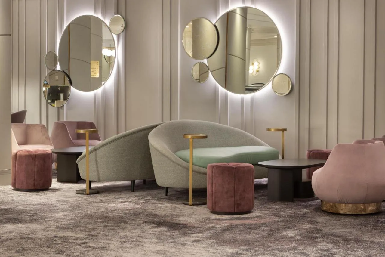 Lobby couch and mirrors at Hilton Glasgow, Glasgow city centre
